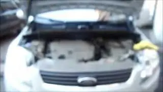 Replacing the parking light bulbs in the headlights of a first-generation FORD KUGA.