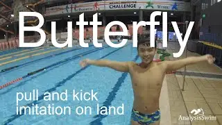 Butterfly pull and kick imitation on land