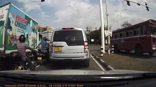 Do you agree with what he did? Lane splitting biker cuts into the path of a truck
