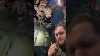 People exploring tiny caves