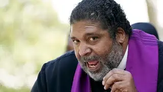 Police escort Rev. William Barber out of Greenville movie theater