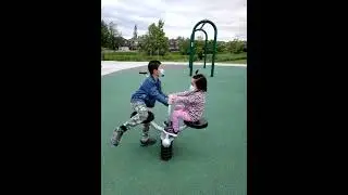 James Cheng and Jacqueline Cheng at park children playground seesaw