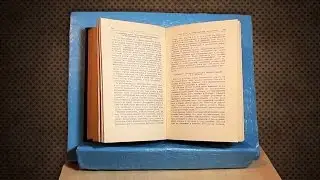 Stand for a book or tablet of cardboard. Craftwork from cardboard