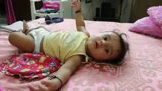 Little Ruhaan playing on bed