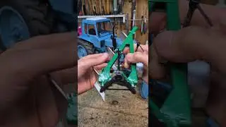 Трактор и плуг для него...
