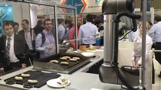 A Robotic Chef Cooking Sausages