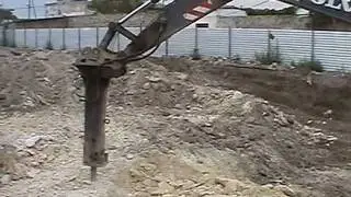 Разработка скального грунта гидромолотом.mpg