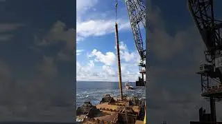 Upending a foundation pile from a cargo barge offshore 🏗️ #construction #engineering