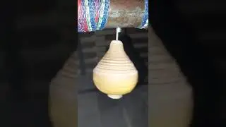 Wood top spining upside down due to magnet slowmo