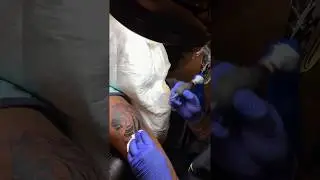 Tattoo of a Lion with Arabic Calligraphy