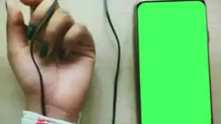 Hand charging green screen video