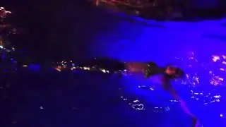 Live mermaid swimming in pool