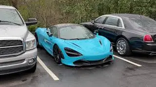 Looking at super cars and luxury cars outside