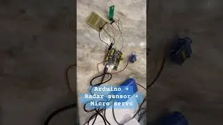 Arduino + microwave radar sensor + servo to try to trigger motion sensor behind glass