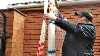 Attaching a throwing cord to a casting net (sorry for the wind)