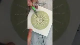 Painting a mandala on a stone. #smallbusiness