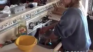 Kathy cleans up at the Lakehouse (April 2000)