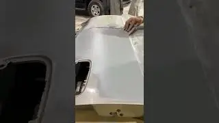 Applying gray putty on door nicely 