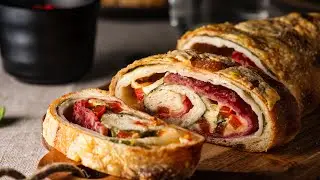 Stromboli - Italian pizza roll. Juicy and very tasty pizza with salami, mozzarella and spinach.