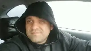 The guy relaxing at the parking lot
