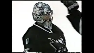 Goalie Evgeni Nabokov ( San Jose Sharks ) scores a goal against Canucks 2002