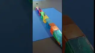 Launching Hot Wheels cars onto a Magnet Tiles Bridge in Slow Motion 