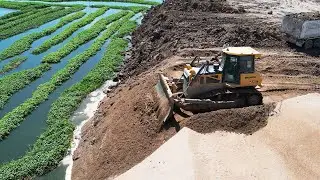 High Level Bulldozer Truck Landfill Operators Have Some Serious Skill Pushing Dirt Into Water