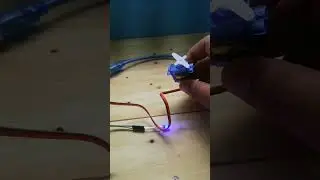 Doing a testing of a servo motor and a bulb on offing/sinhala