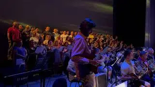Playing rock guitar solo with full symphony orchestra and 65-piece choir