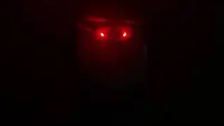 Sitting scarecrow in dark 