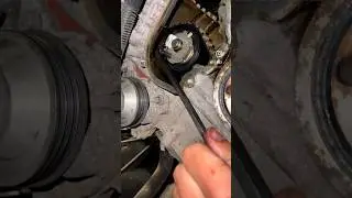 Tensioning the timing belt on a PSA 3 cylinder wet belt engine 
