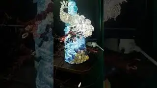 павлин из страз на бутылке