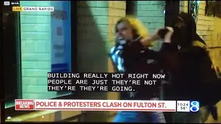Bat Girl / White rioter in Grand Rapids tries to break window