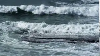 waves rolling over rocks