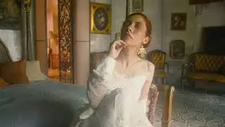 mixkit a tattooed vintage woman in an old fashioned bedroom 41511