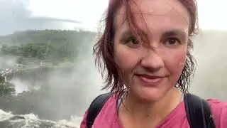 woman wet hair from water portrait making selfie in front of iguasu falls travel tourism places