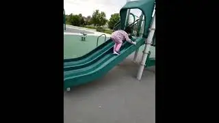 James Cheng and Jacqueline Cheng children playground slide climbing upward