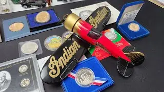 Indian Motorcycle Airplane Bank with silver coins currently for sale on eBay