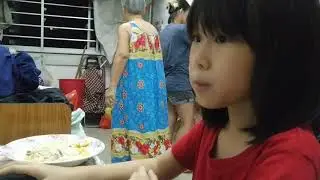 Theophania Chong playing game on laptop.