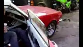 Laszlo's boss Andy revving 4.7 litre Mustang