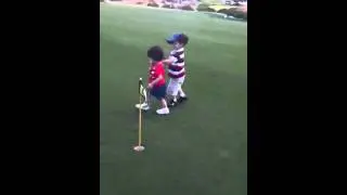 Elijah & Roma golfing