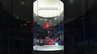 Can you count how many circles (over/unders) the flyer in the blue helmet makes?