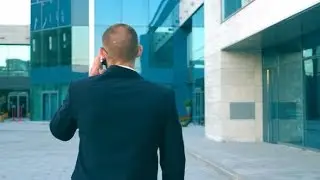 Young Businessman Talking on Phone and Walking in Street.  | Videohive Project Templates