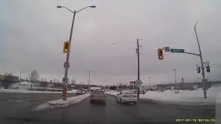 Nissan Slips on Ice, Recovers Before Causing Collision