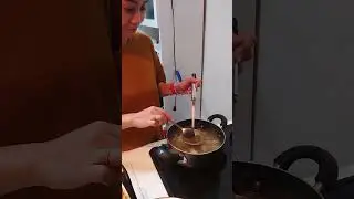 Filipina cooking curry.