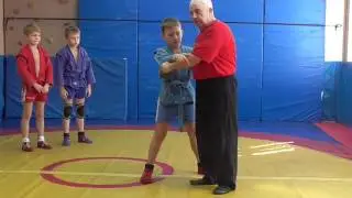 Бросок через бедро с захтом пояса сзади