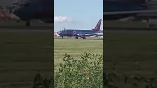 Jet2 chrome and red B737 taking off into Manchester 