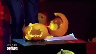 Italian journalist smashing pumpkins against Halloween festivities