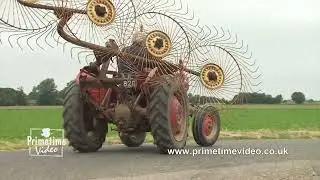 Massey Ferguson 135 working with a hay rake