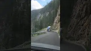 Tour bus drives down Yoho Valley Road Switchbacks from Takakkaw Falls